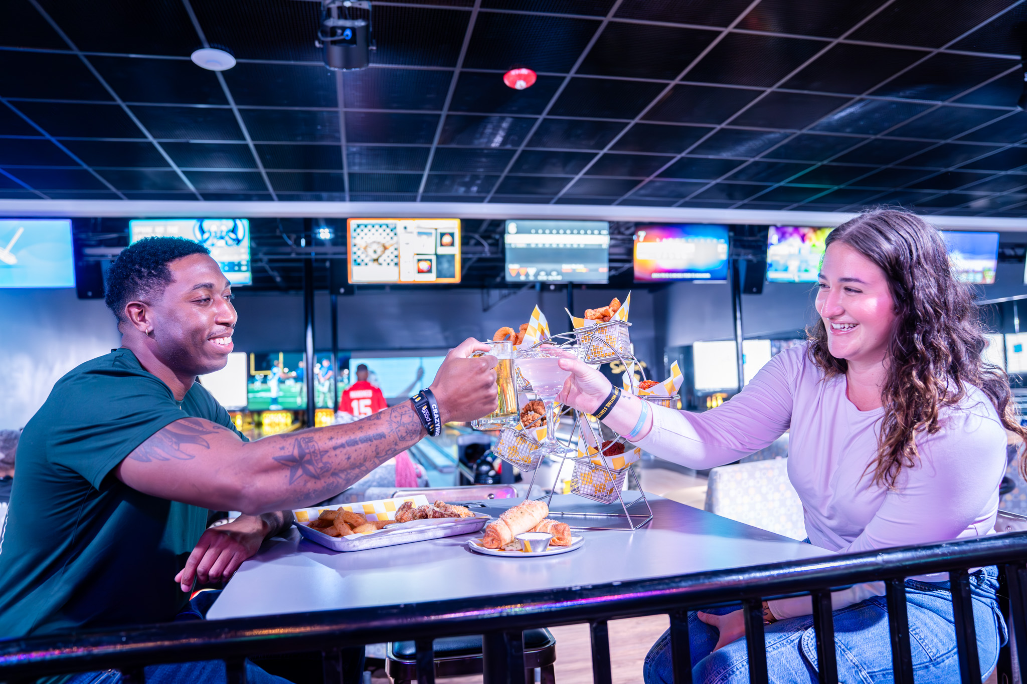 a couple has a spread of food and drinks